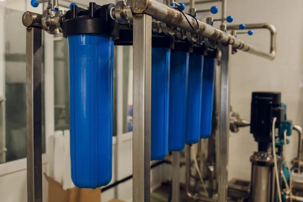 Rainwater water filtration system, industrial water purifiers, with blue filter vessels.