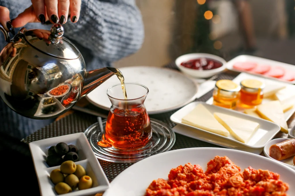 Breakfast in the rain: traditional Turkish table with tea, olives, jam and cheese.